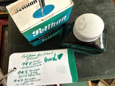 top view of Pelikan 4001 Brilliant Green ink and box, with col-o-ring swatch of the ink color in main view